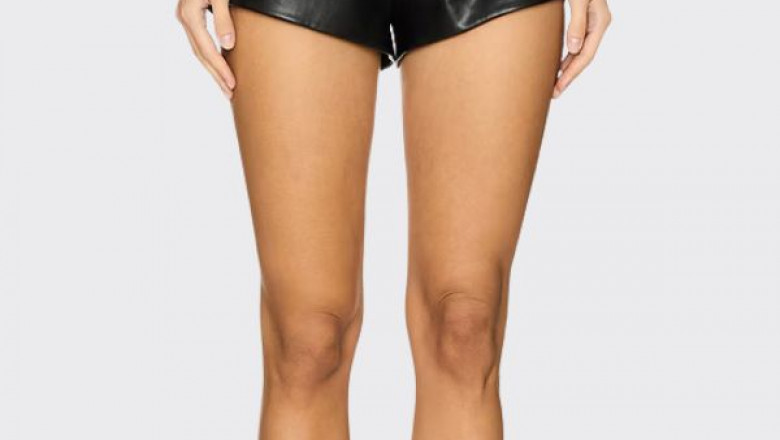 How can leather shorts be styled for different seasons